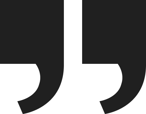 Two large black quotation marks on a white background symbolize the power of feedback, much like personal trainer reviews that offer insights and inspiration.